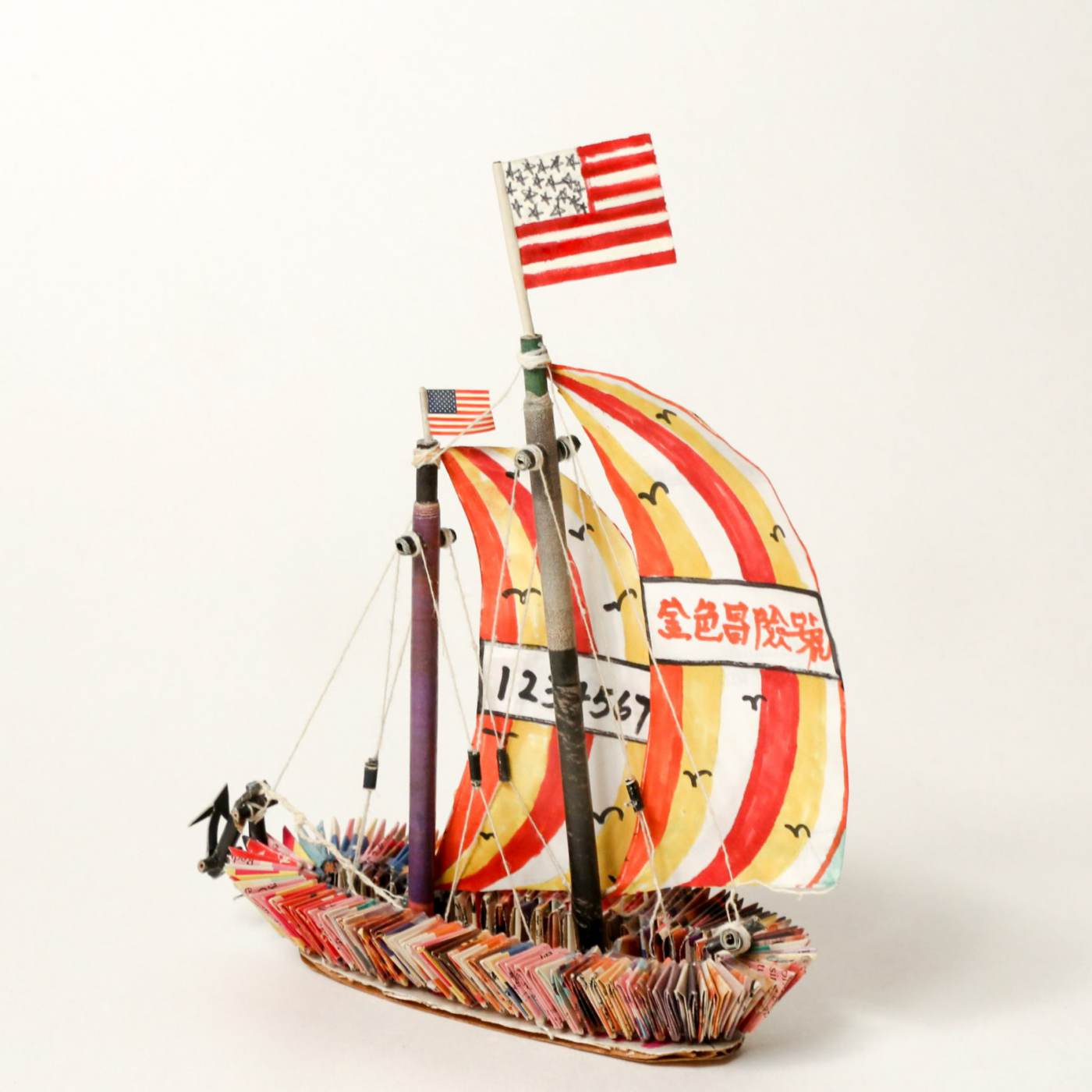 Sailboat (Golden Venture, Golden Vision), 1995, folded magazine pages, rolled and cut white paper, cardboard, thread, liquid glue and colored marker, Museum of Chinese in America (MOCA) Collections