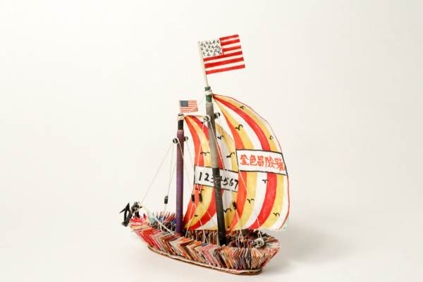 Sailboat (Golden Venture, Golden Vision), 1995, folded magazine pages, rolled and cut white paper, cardboard, thread, liquid glue and colored marker, Museum of Chinese in America (MOCA) Collections