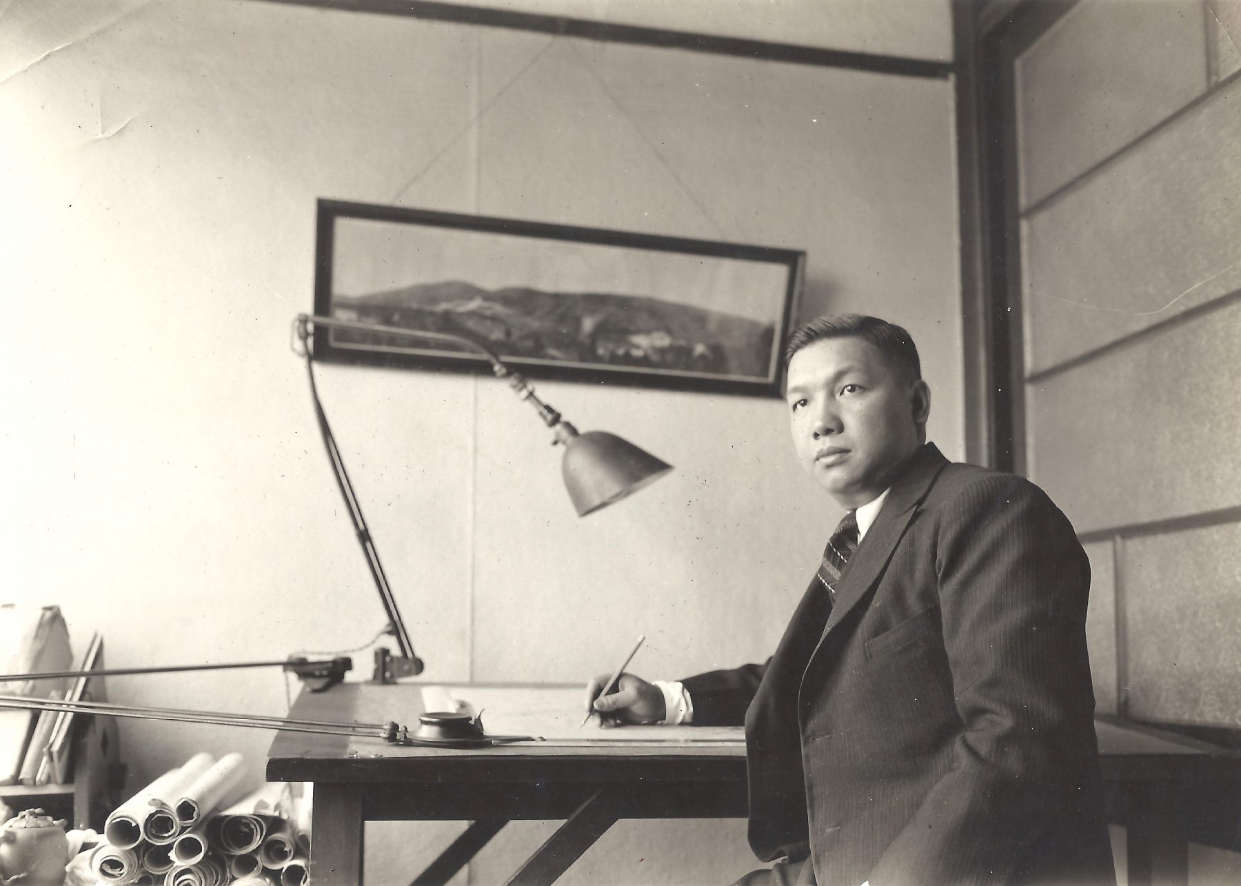 Poy Gum Lee at his desk