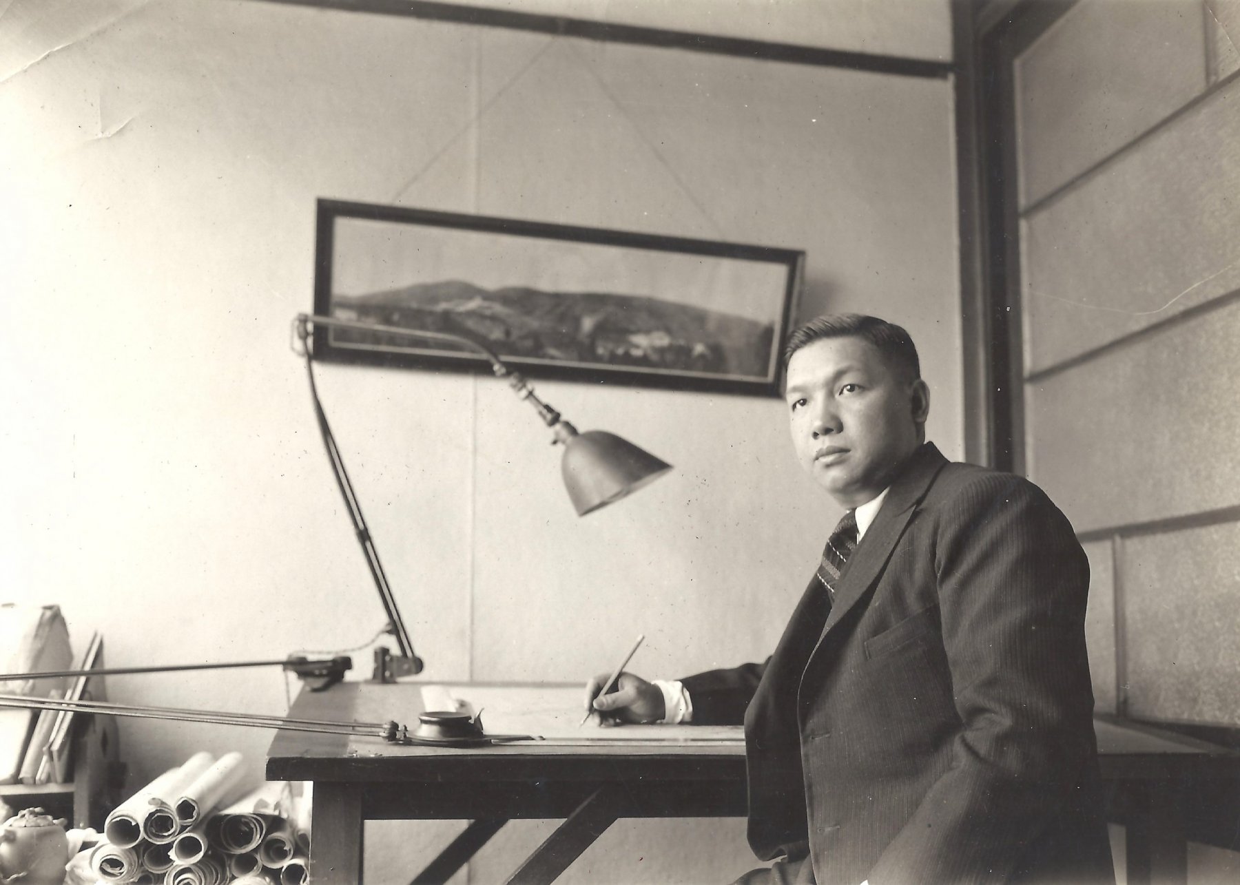 Poy Gum Lee at his desk 