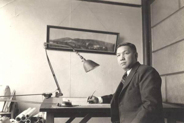 Poy Gum Lee at his desk 