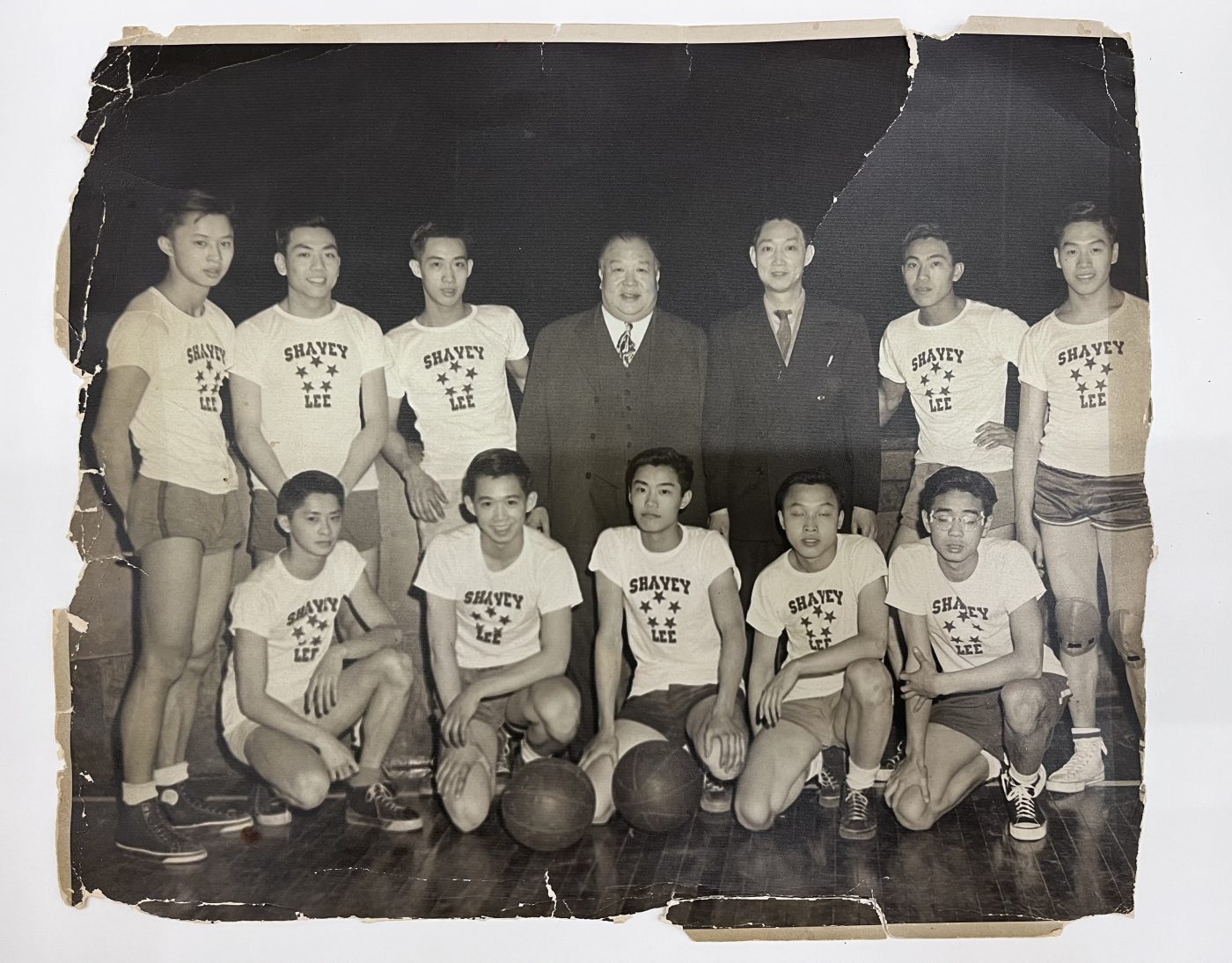 Group photo of Shavey Lee's basketball team, taken ca. 1944. Standing, from left to right are: Dory Lum, Leung Gay Lee, Stanley Chin, Shavey Lee, Lung Chin, Richard Chin, and Moody Chin. On the bottom row are: Danny Lum, Stephen Chin, Donald Chin, and Newton Chin. Museum of Chinese in America (MOCA) Collection.