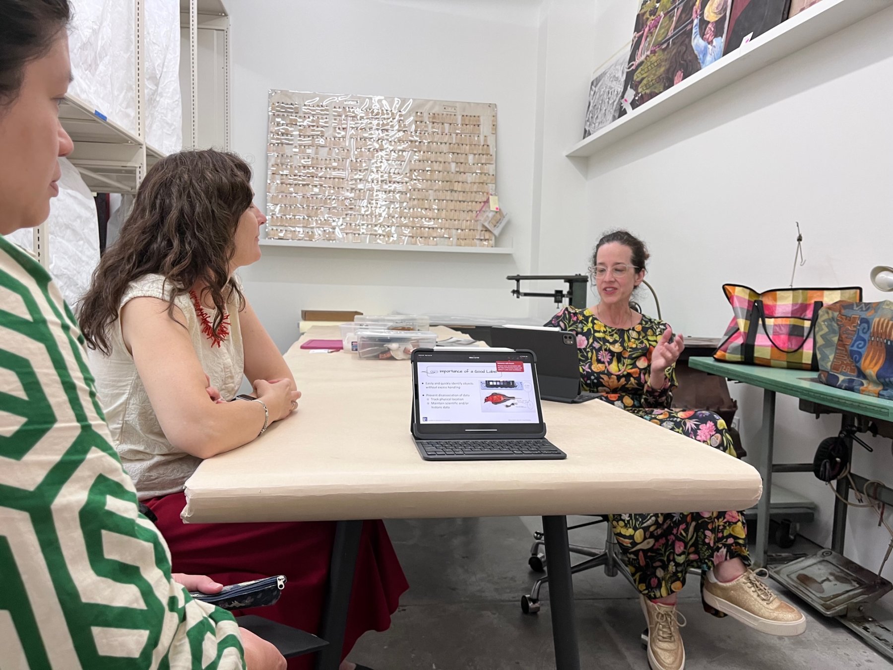 Conservators at A.M. Art Conservation, Anne Léculier King and Eugenie Milroy, giving a presentation on museum object labeling methods to MOCA staff as precursor to a hand-on workshop.