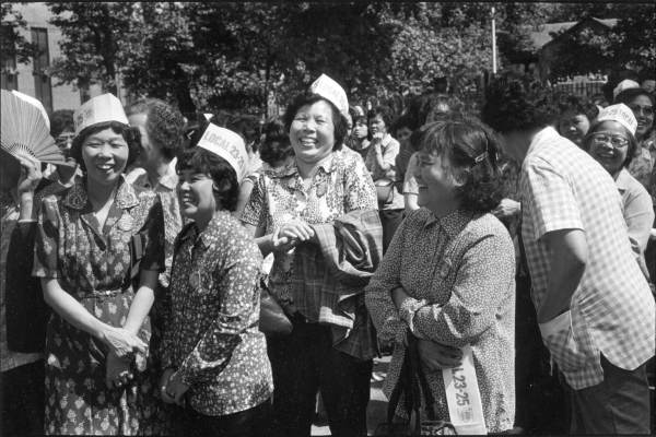 Women from Local 23-25 at the International Ladies’ Garment Workers’ Union (ILGWU) garment workers' rally in Columbus Park in 1982. Photograph by Paul Calhoun. MOCA Collections.

The scale is hard to discern from the close-up range of this photograph, but as many as 20,000 garment workers and their supporters marched and gathered in Columbus Park on June 24th and July 25th, 1982, in two of the largest demonstrations of worker unity and collective strength in New York Chinatown history.
