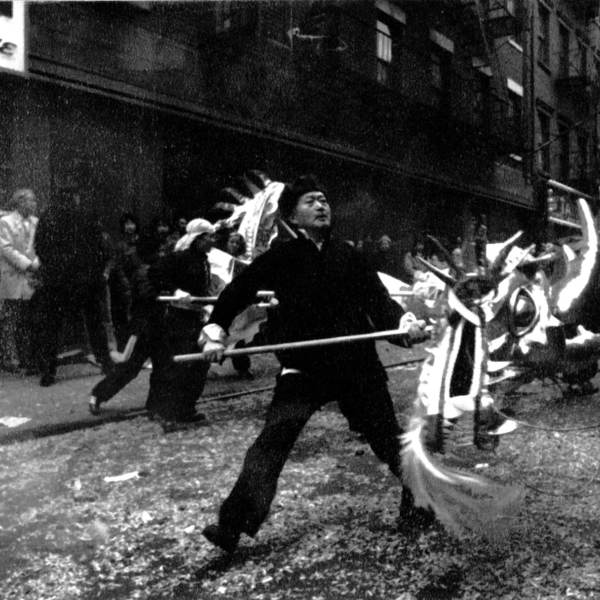 2016.025.004 Shifu Woo Chia Meng with a dragon head during a Chinese New Year celebration in New York's Chinatown in 1977.