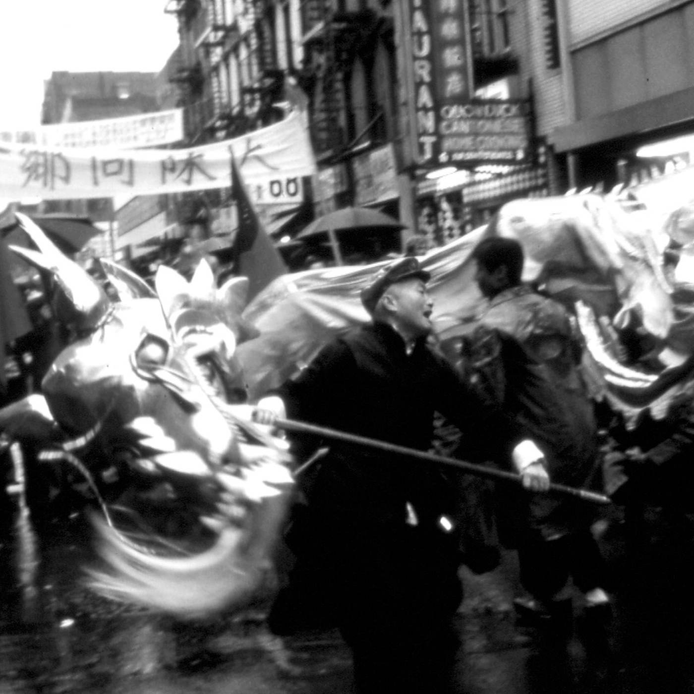 2016.025.005 Shifu Woo Chai Meng holding a dragon head along with members of the New York Honan Shaolin Association's Golden Dragon Team during the 1979 Lunar New Year celebration in New York Chinatown. Photograph taken by Richard Zak. Courtesy of the Honan Shaolin Association, Museum of Chinese in America (MOCA) Collection.