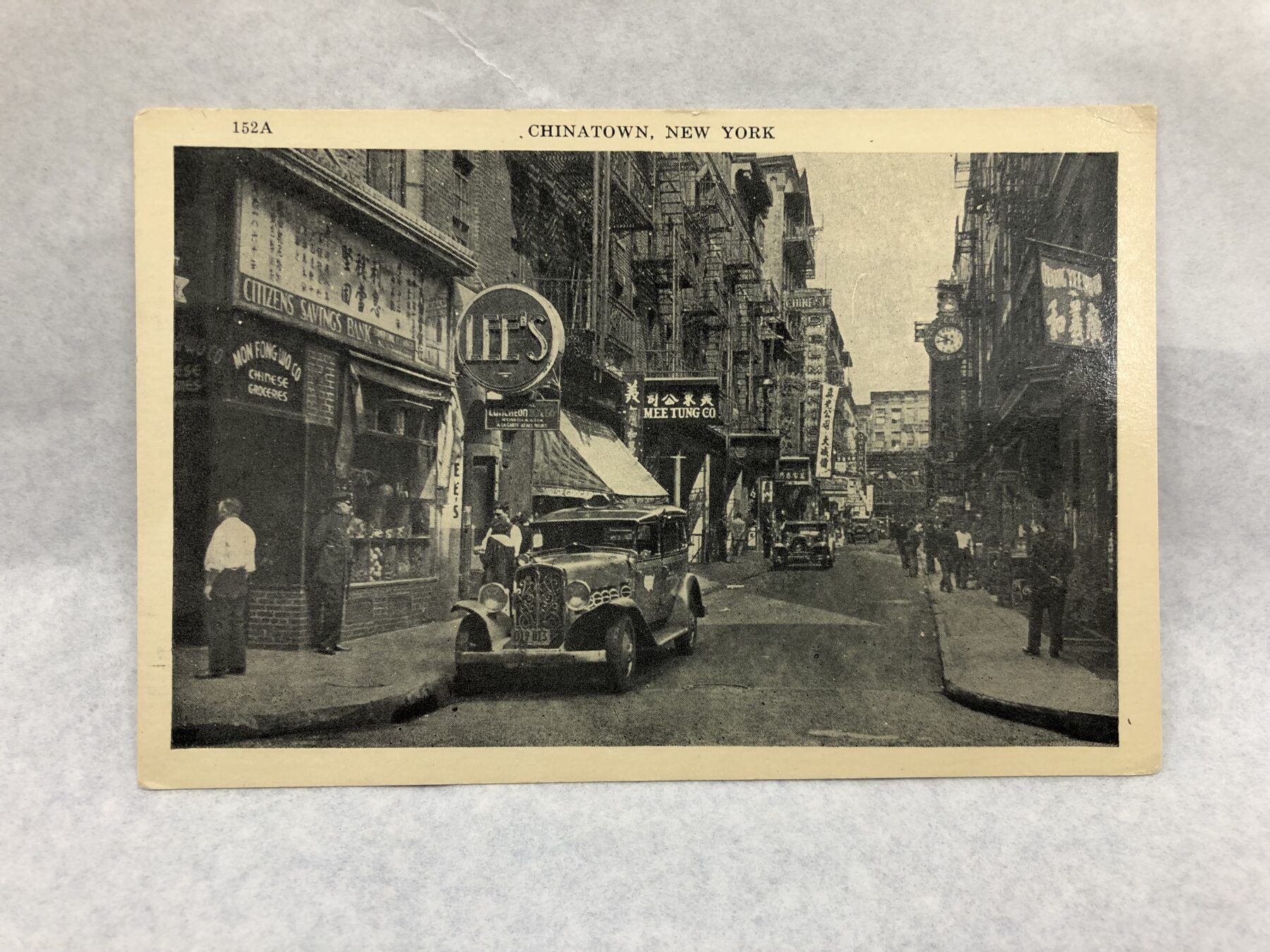 A postcard of Lee's Restaurant, with a shot of the exterior and unique circular sign. Courtesy of Alex Jay. Museum of Chinese in America (MOCA) Collection.