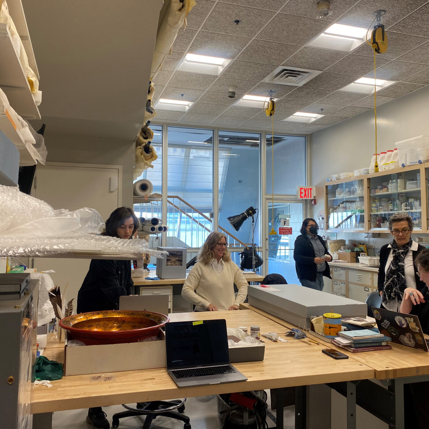Professor Pamela Hatchfield, AM Art Conservator Rachael Perkins Arenstein and students at the NYU Conservation Center, Photograph taken by Yue Ma.
