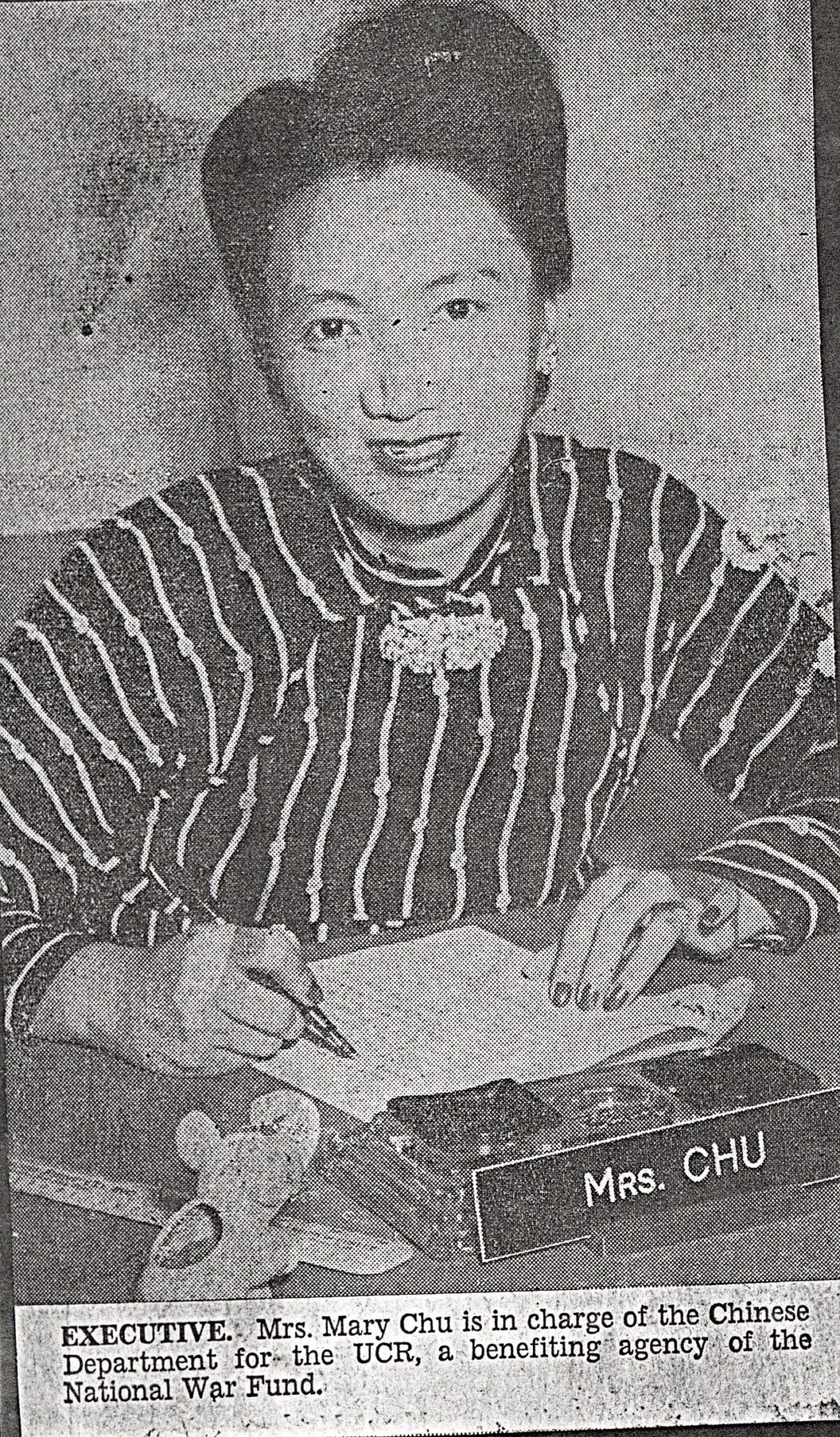 Mary Chu (who later remarried and took the name Mary Foo) at  the United China Relief office, from the New York World Telegram, October 23, 1945. Courtesy of Mary Foo, Museum of Chinese in America (MOCA) Collection.