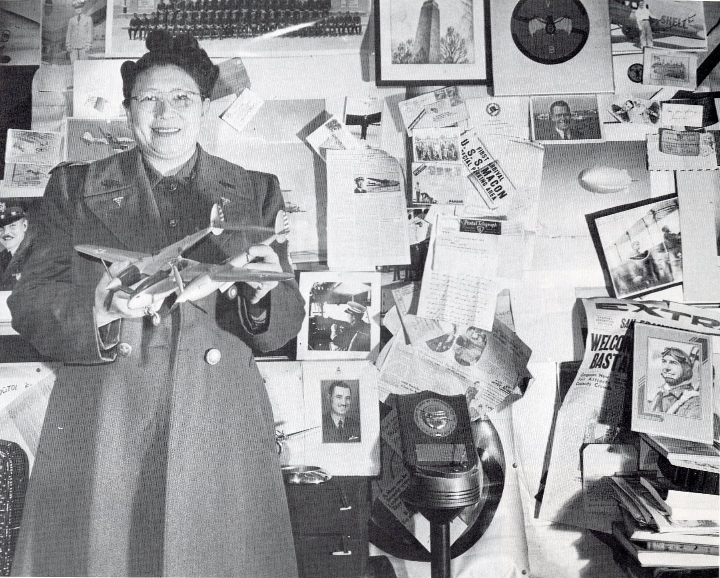 Dr. Margaret Jesse Chung holding a model of a Lockheed P-38 Lightning amidst photographs of some Flying Tigers that she helped recruit among her adopted sons. Reprinted from Judy Yung, Chinese Women of America: A Pictorial History (University of Washington Press, 1986). Museum of Chinese in America (MOCA) Library Collection.